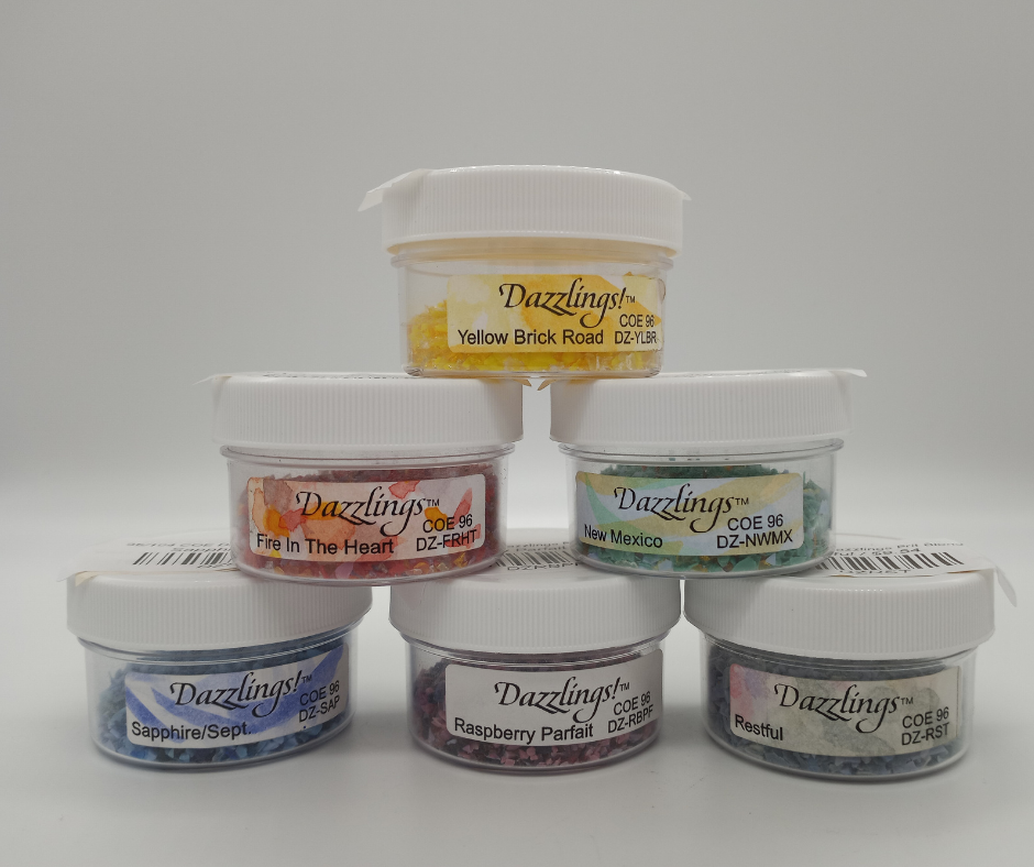 Stack of small jars of multicolored frit