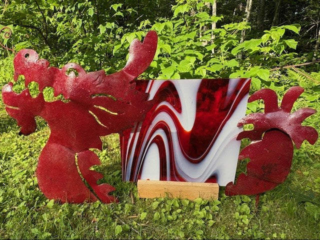 Oceanside Strawberries and Cream Glass on a garden sculpture of a dragon