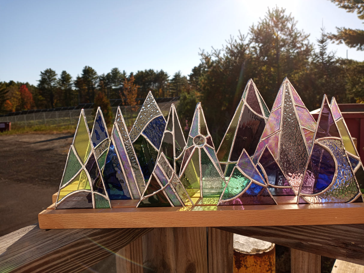 wood display stand with stained glass trees