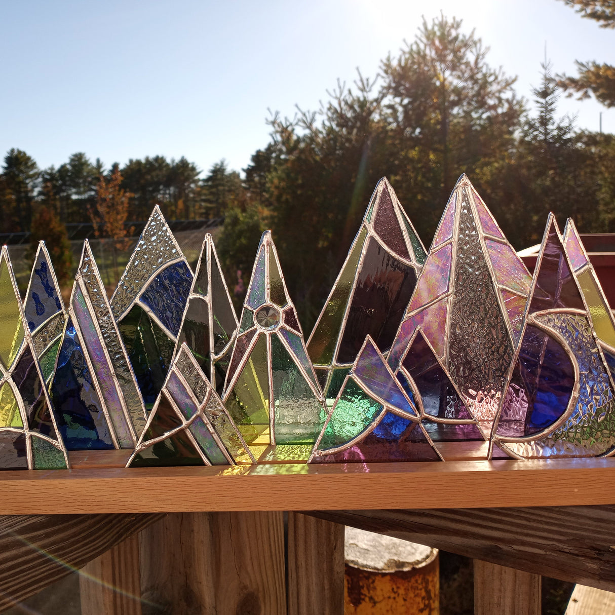 wood display stand with stained glass trees