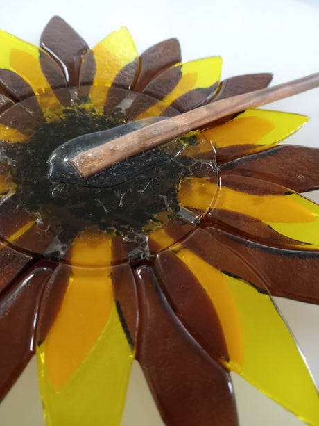 1/8" copper tube hammered flat and glued to back of fused glass flower