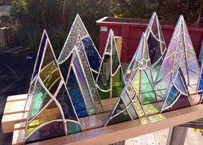 wood display stand with stained glass trees