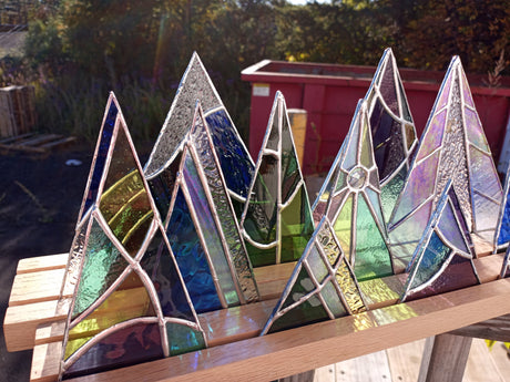 wood display stand with stained glass trees