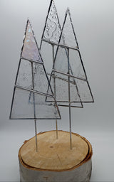 3 stained glass trees on a birch log