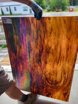 russet streaky iridescent glass backlit with natural light