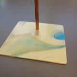 washer attached to the back of glass for plant stakes
