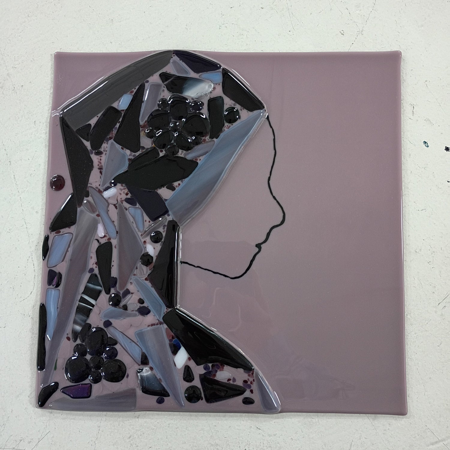 fused glass profile portrait in purple